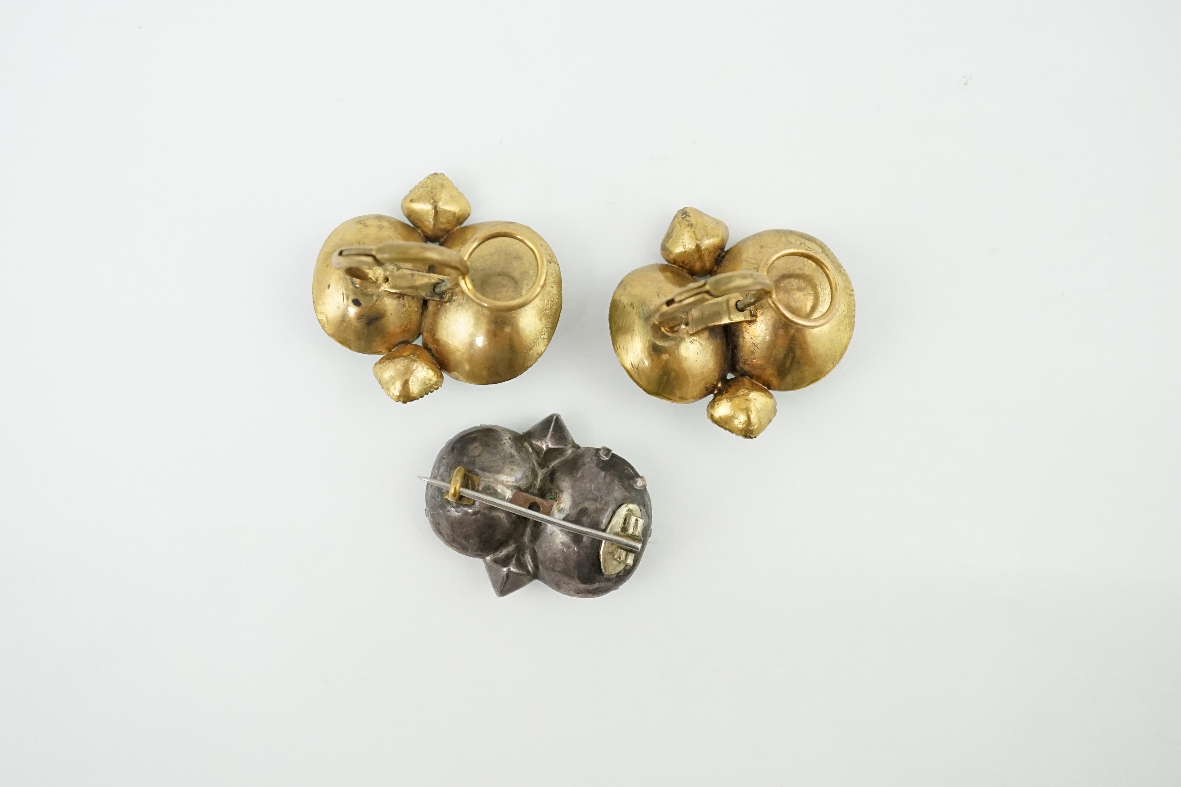 A rare pair of 18th century 'Queen Anne' gilt metal and foil backed paste ear clips with original fittings and a similar two colour paste set brooch